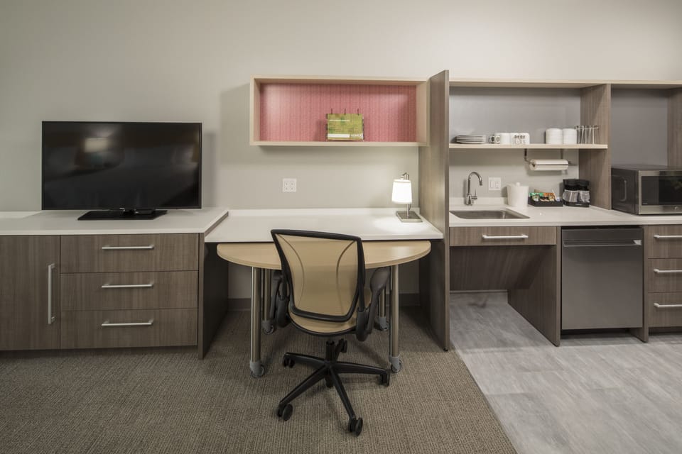 Desk, blackout drapes, iron/ironing board, cribs/infant beds