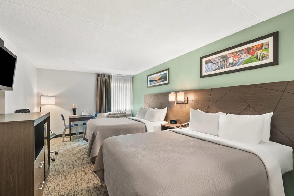 Standard Room, 2 Queen Beds, Non Smoking | Desk, blackout drapes, iron/ironing board, free cribs/infant beds