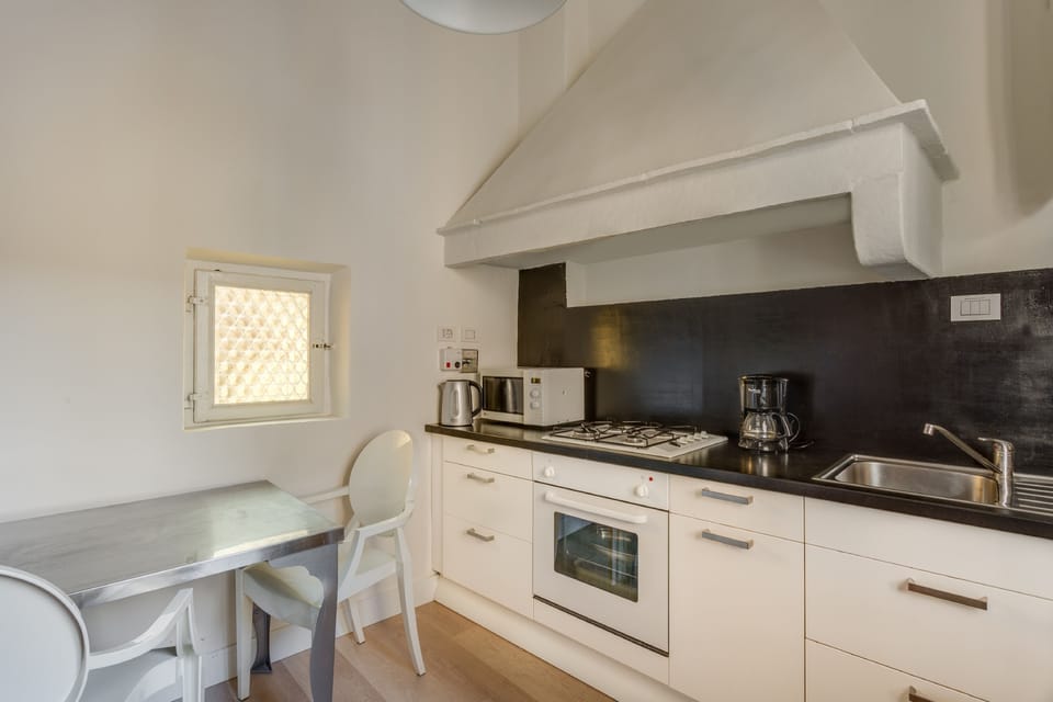 Apartment, 4 Bedrooms | Private kitchen | Fridge, microwave, oven, stovetop