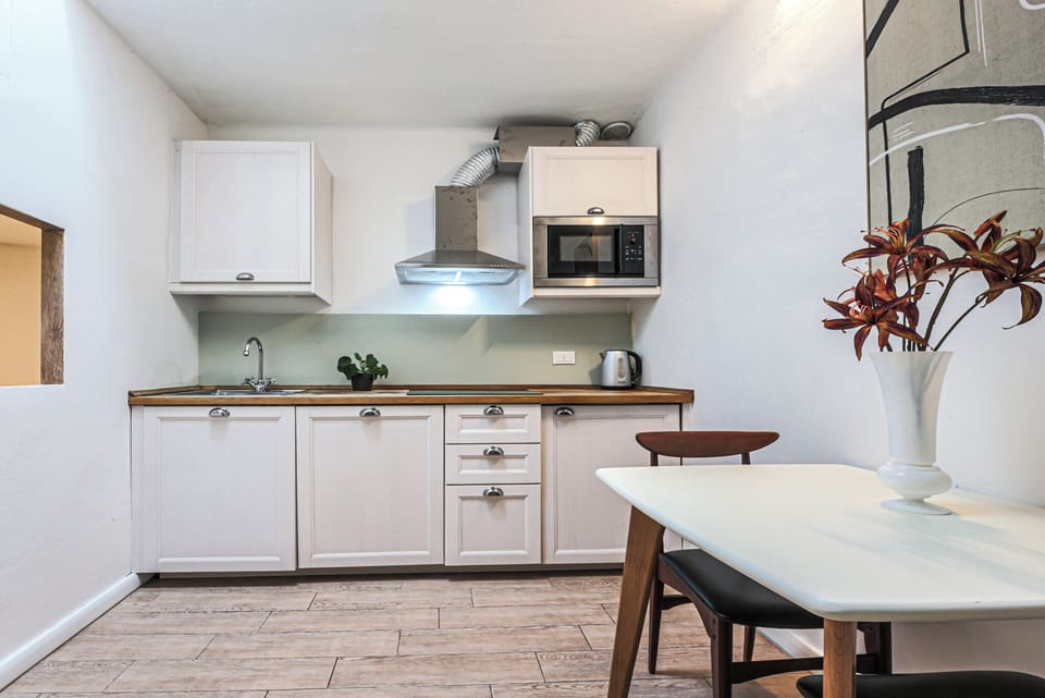 Apartment, 2 Bedrooms | Private kitchen | Fridge, microwave, stovetop, coffee/tea maker