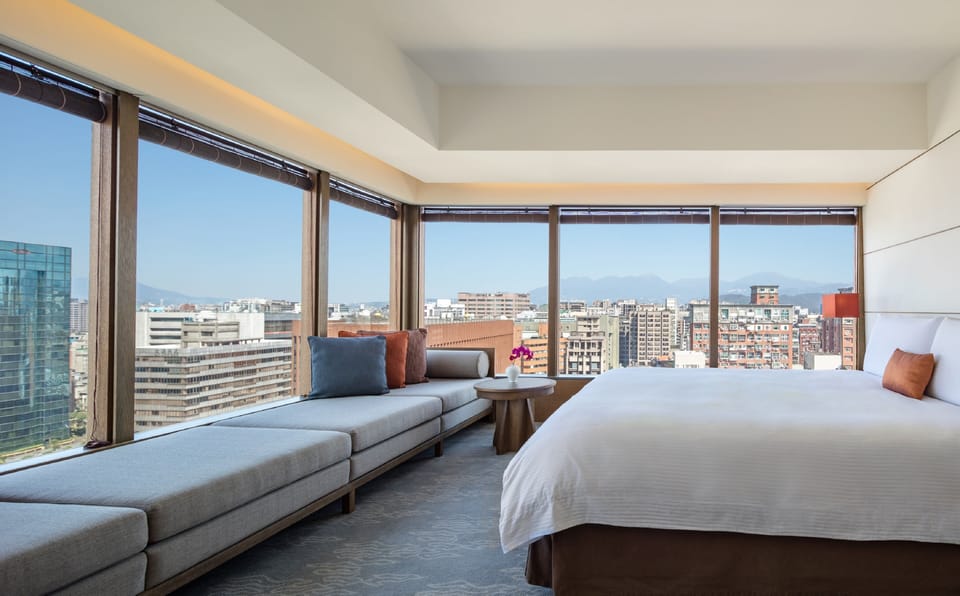 Corner Suite, one King bed | Down comforters, in-room safe, desk, laptop workspace