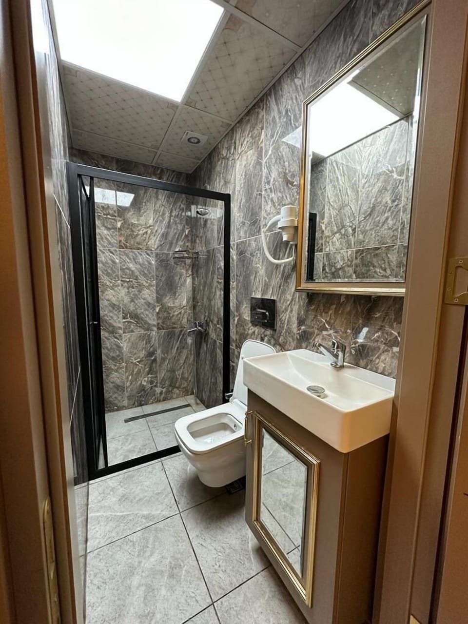Economy Double Room | Bathroom | Shower, hair dryer, slippers, towels