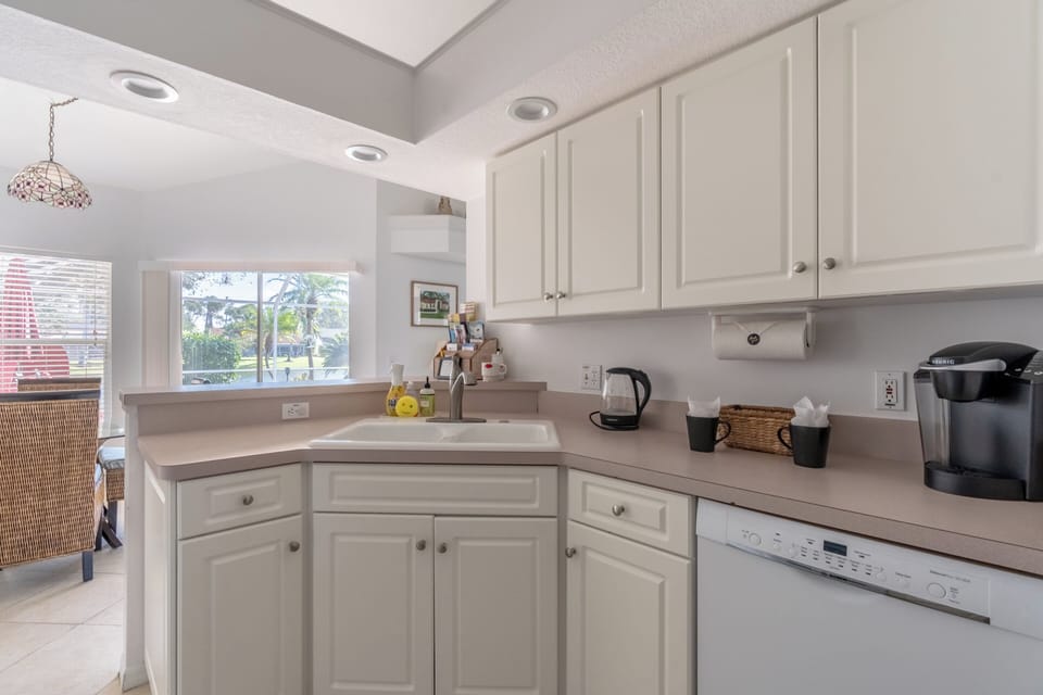 Fully stocked kitchen with oven, microwave, utensils, coffee machine and kettle