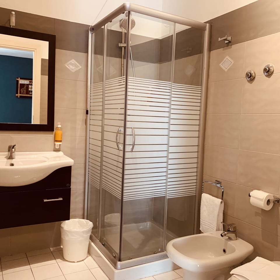 Deluxe Triple Room, Private Bathroom, Poolside | Bathroom | Shower, eco-friendly toiletries, hair dryer, bidet