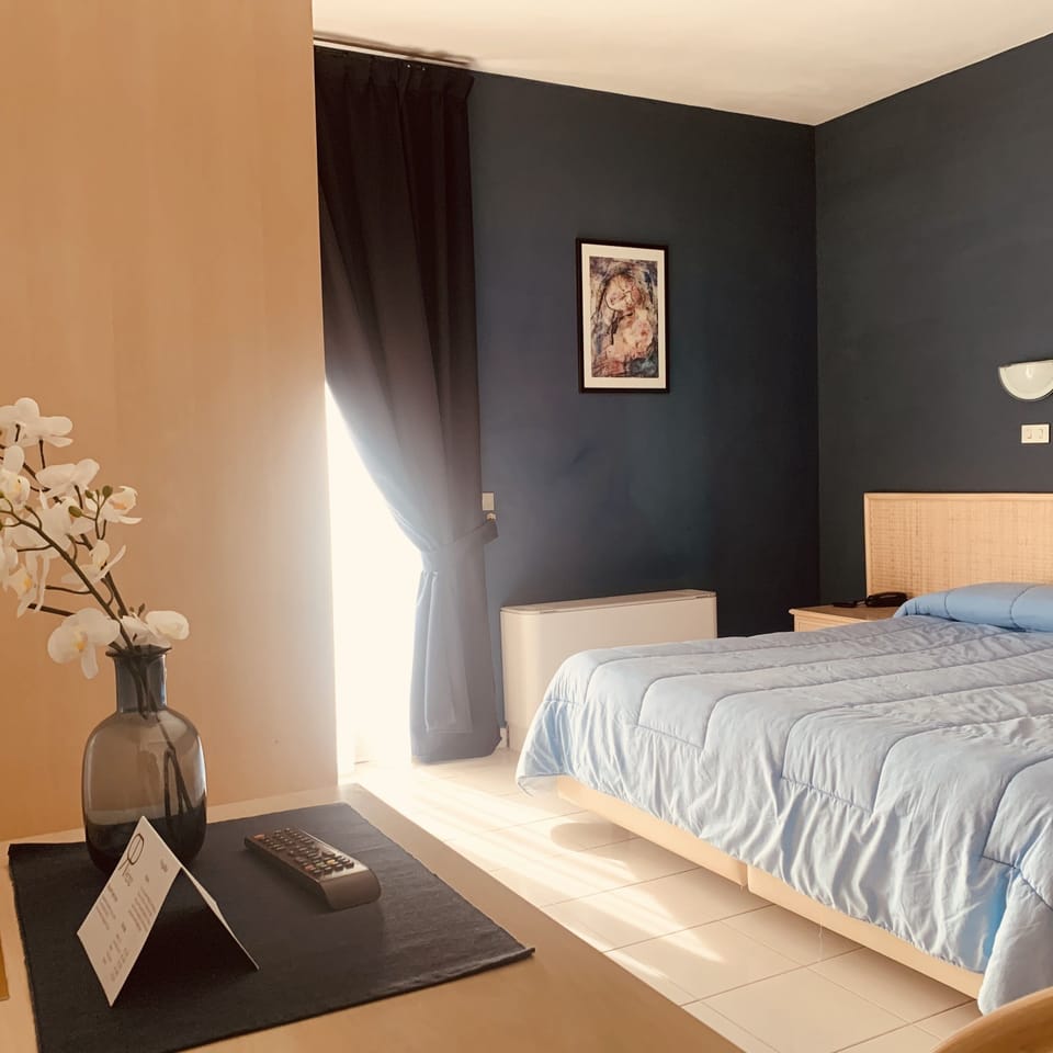 Deluxe Triple Room, Private Bathroom, Poolside | Down comforters, minibar, in-room safe, desk