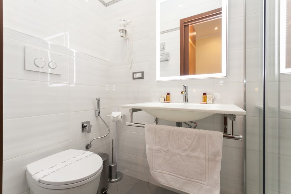 Shower, free toiletries, hair dryer, towels