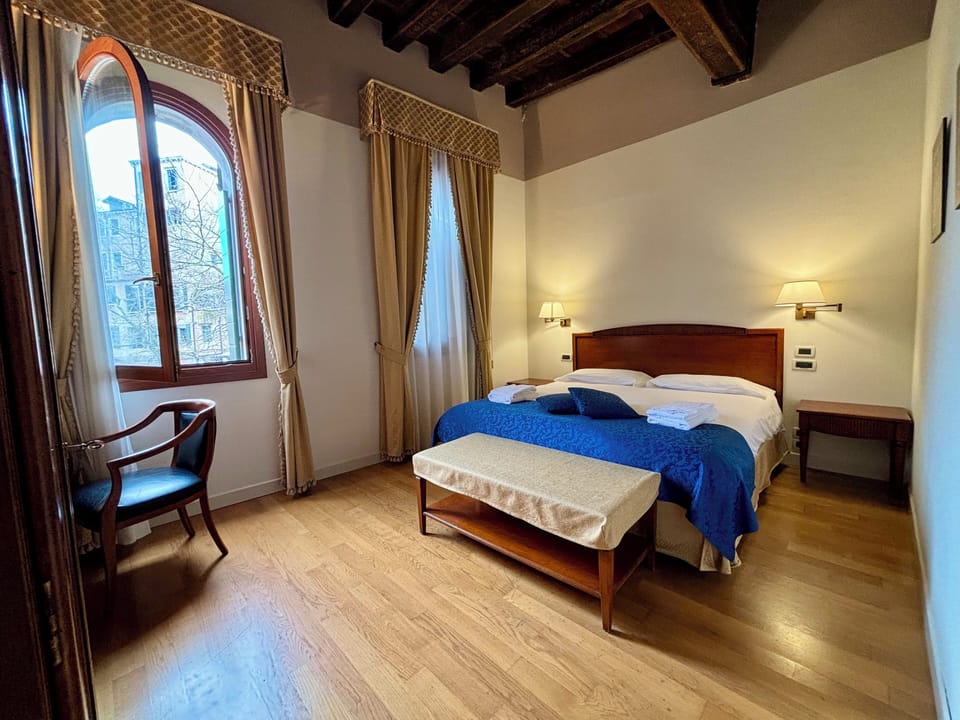 Superior Quadruple Room with private Balcony | Minibar, in-room safe, desk, laptop workspace