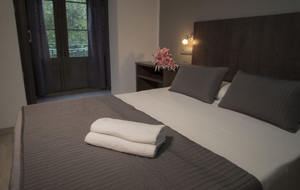 Family Quadruple Room, 2 Queen Beds | In-room safe, desk, laptop workspace, blackout drapes