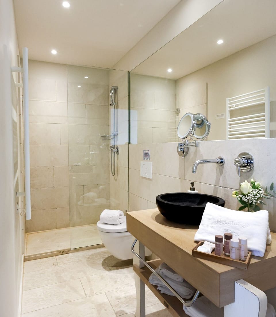 Suite, Sea View | Bathroom | Shower, hair dryer, towels, soap