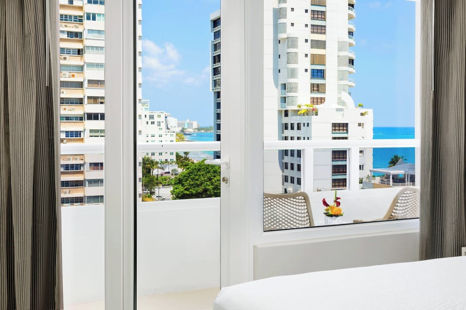 Room, 1 King Bed, Balcony | In-room safe, desk, laptop workspace, blackout drapes