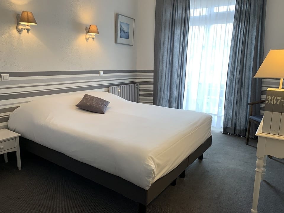 Triple Room | Select Comfort beds, desk, iron/ironing board, free cribs/infant beds