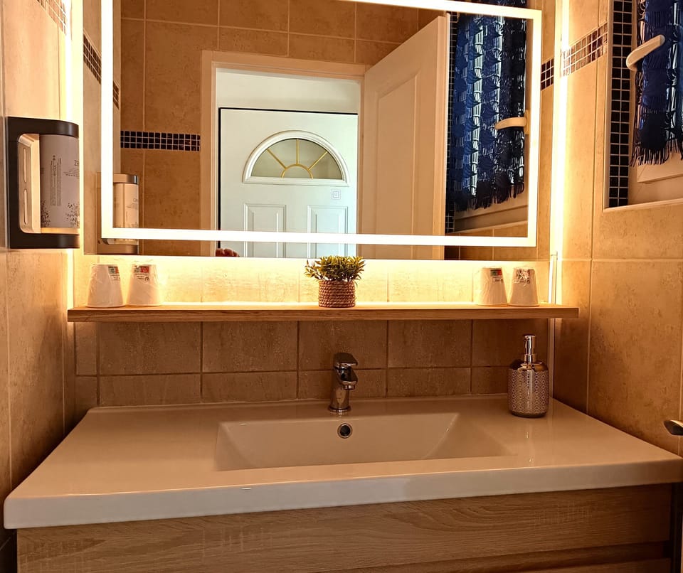 Family Suite, Garden View | Bathroom | Shower, free toiletries, hair dryer, soap