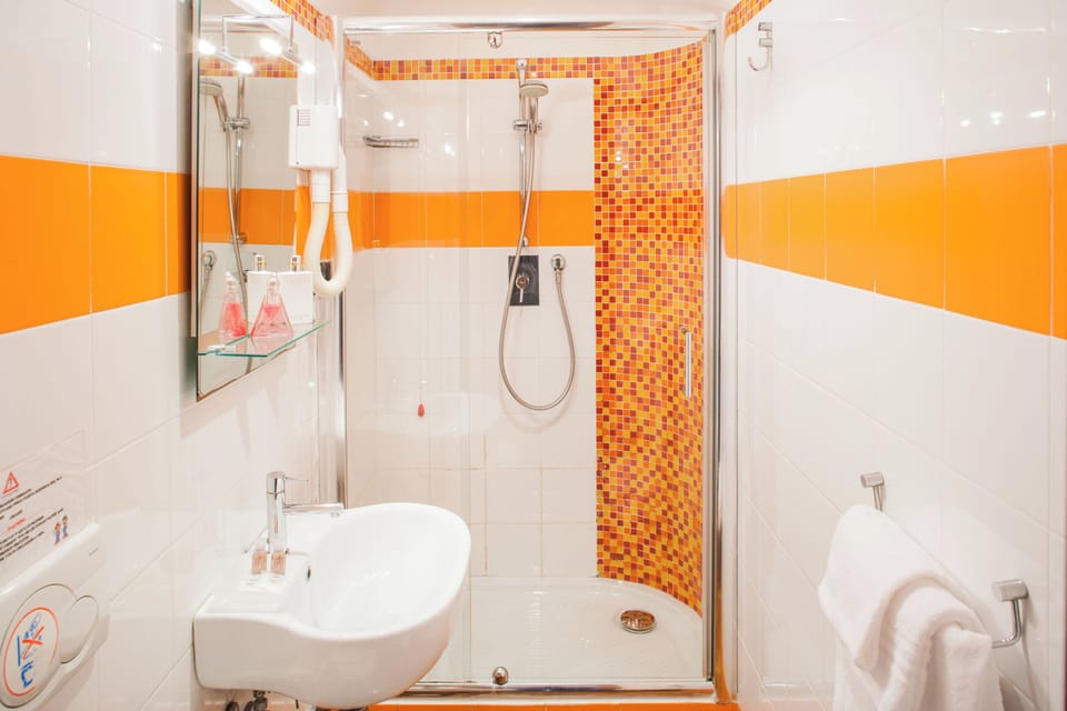 Shower, rainfall showerhead, hair dryer, towels