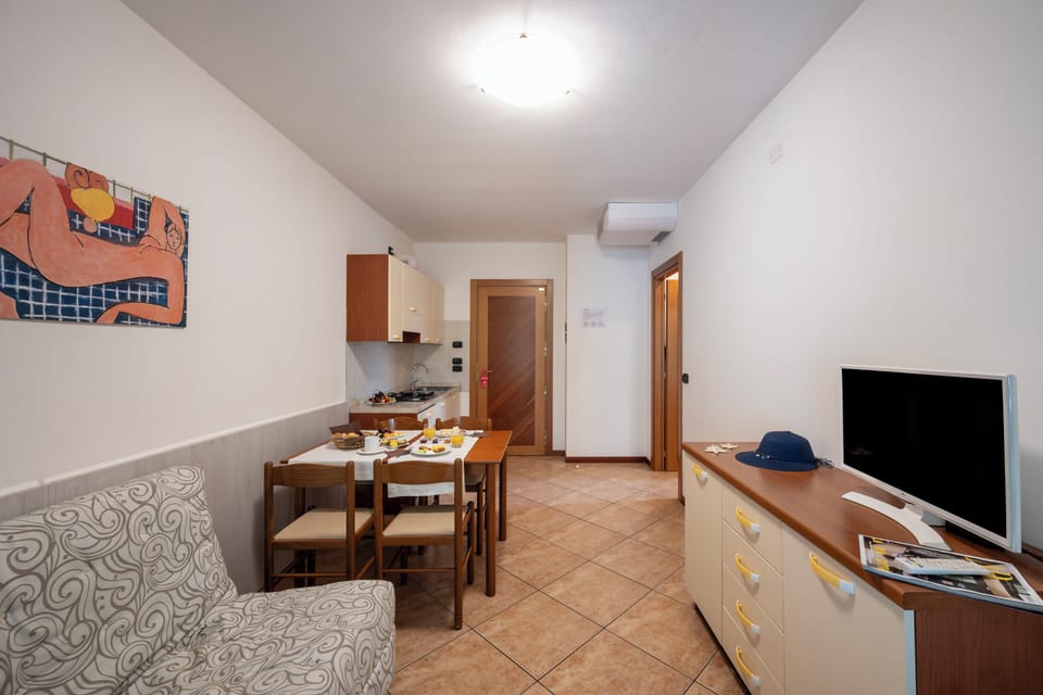 Family Apartment, Balcony | Living area | Flat-screen TV