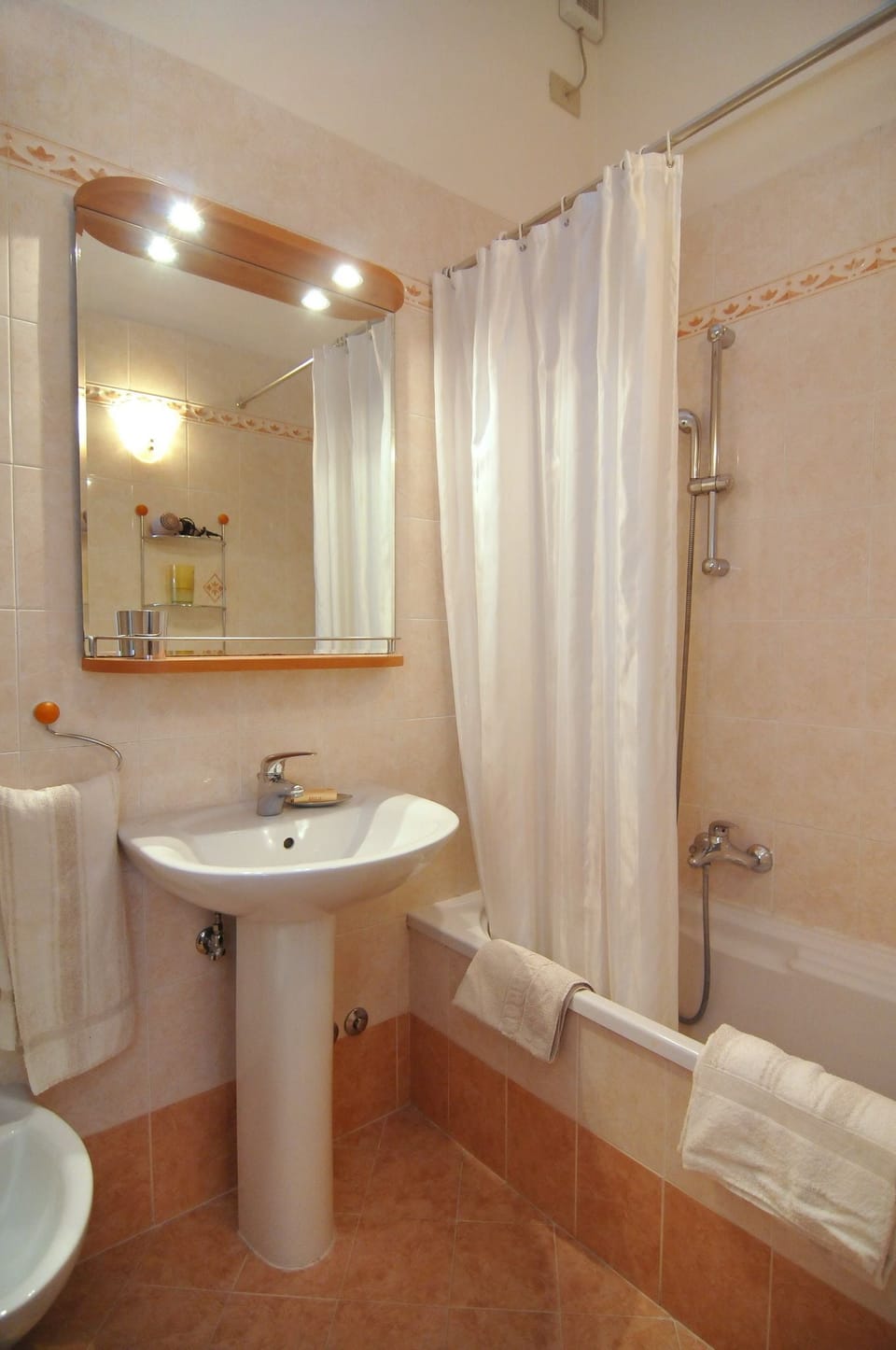 Bathroom | Shower, rainfall showerhead, hair dryer, towels