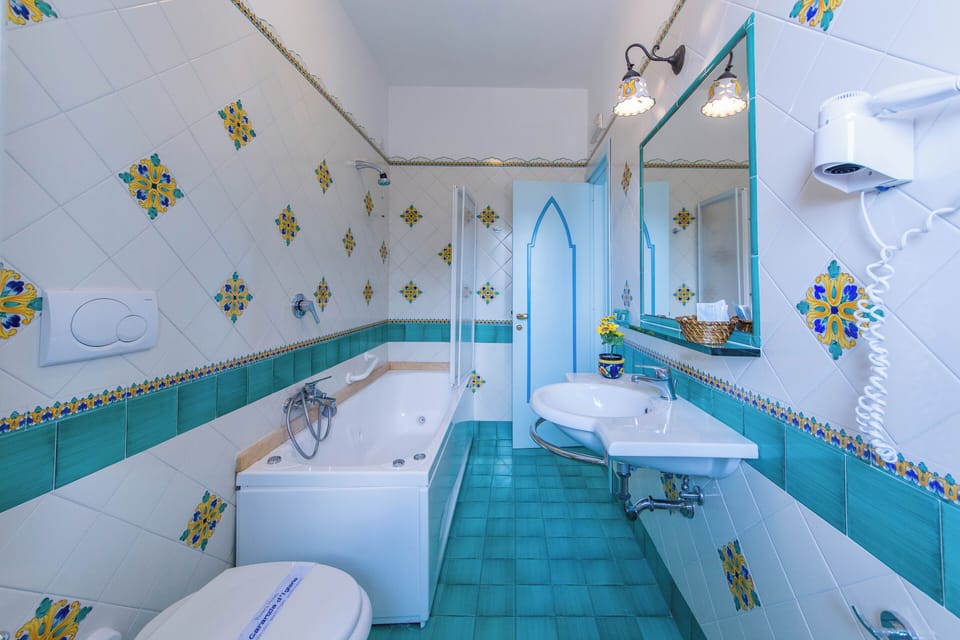 Comfort Condo, 1 Bedroom, Sea View | Bathroom | Shower, deep soaking tub, rainfall showerhead, free toiletries