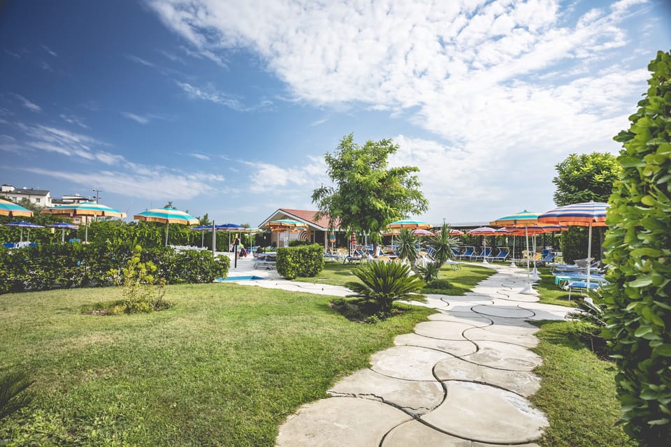 2 outdoor pools, open 8:00 AM to 7:00 PM, pool umbrellas, sun loungers