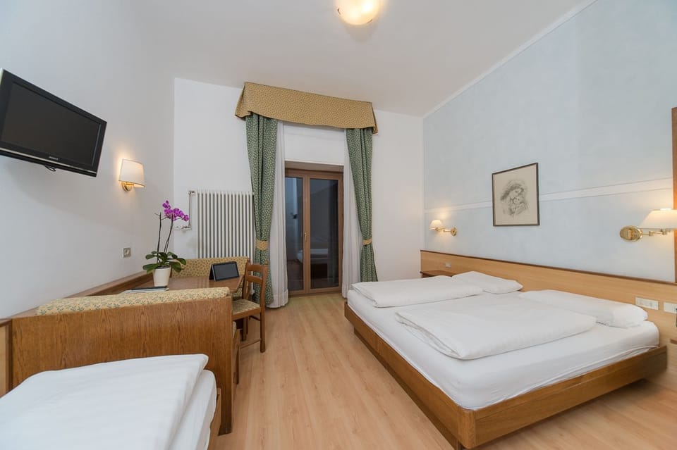 Triple Room | Hypo-allergenic bedding, down comforters, in-room safe, desk