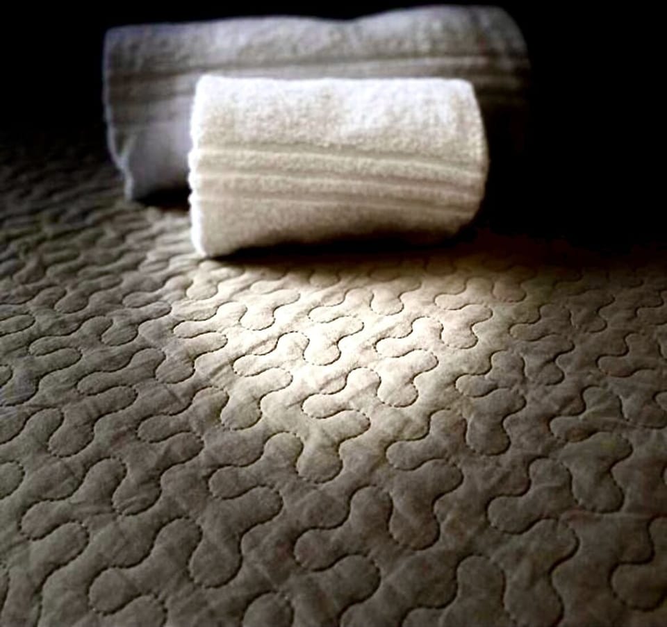 Premium bedding, down comforters, memory foam beds, desk