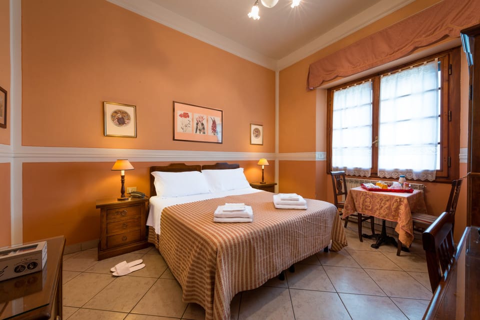 Double Room | Minibar, in-room safe, individually decorated, desk