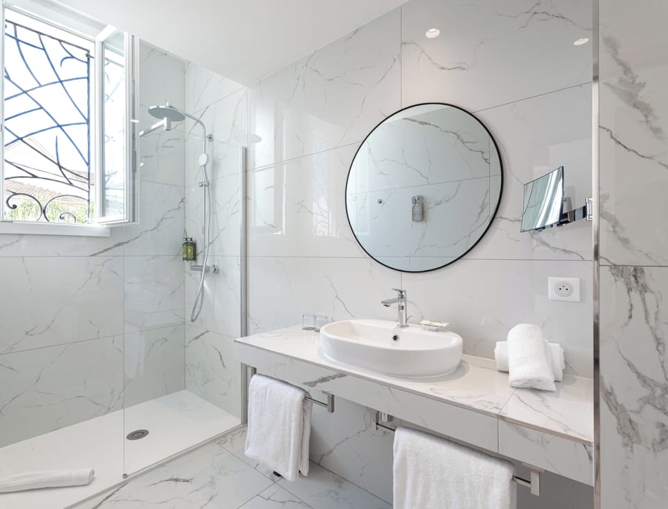 Shower, free toiletries, hair dryer, slippers