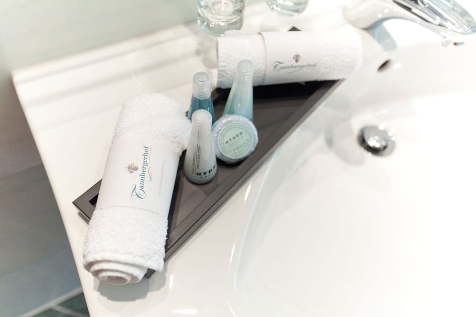 Hair dryer, bathrobes, slippers, towels
