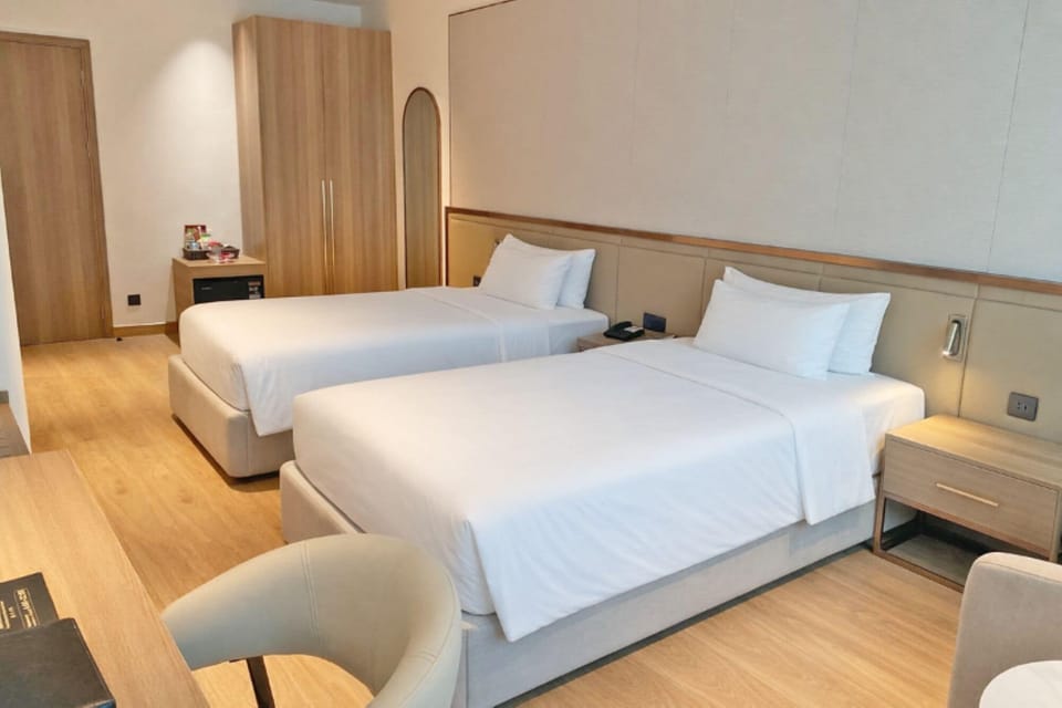 Premium Double Room Single Use, Multiple Beds, City View | Minibar, in-room safe, desk, blackout drapes