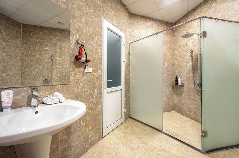 Family Room, City View | Bathroom | Free toiletries, hair dryer, bathrobes, slippers
