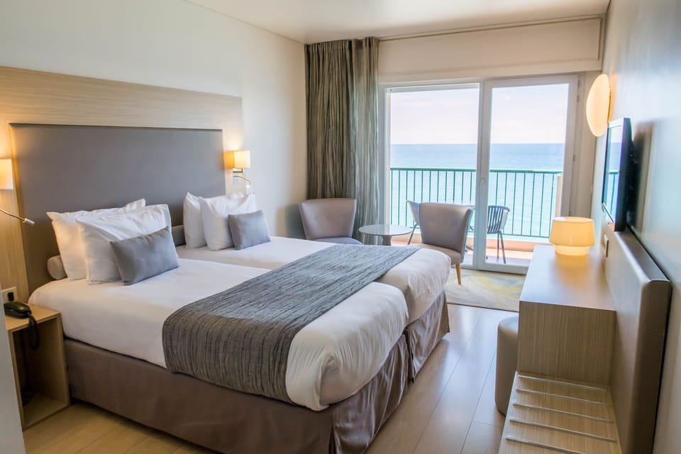 Double or Twin Room, Sea View | Minibar, in-room safe, desk, soundproofing