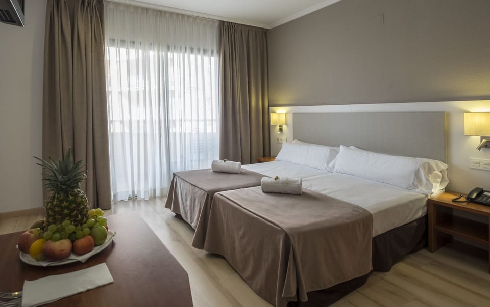 Double or Twin Room, Balcony | Down comforters, in-room safe, desk, blackout drapes