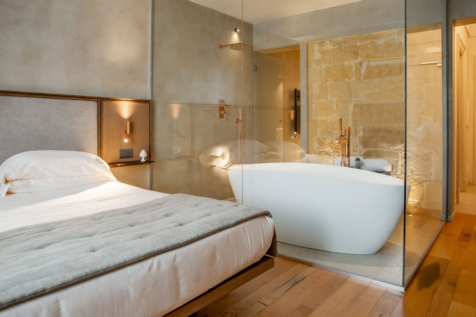 Junior Studio Suite, 1 King Bed, Bathtub | Bathroom | Combined shower/tub, deep soaking tub, rainfall showerhead, hair dryer