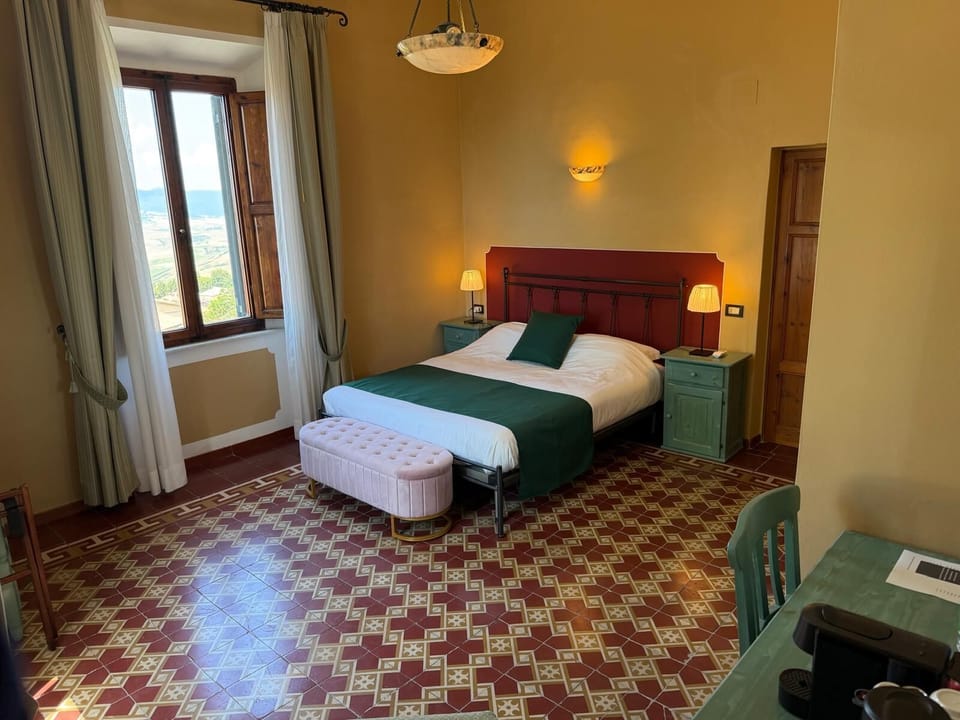 Deluxe Double Room, Hill View | Minibar, in-room safe, desk, laptop workspace