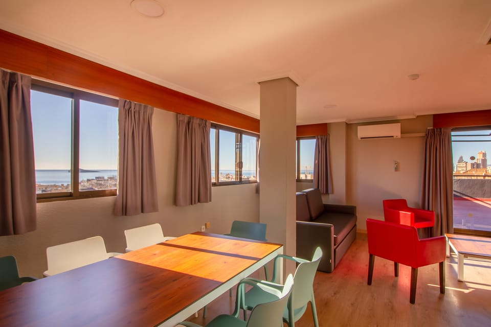 Standard Penthouse | Living area | Flat-screen TV, books