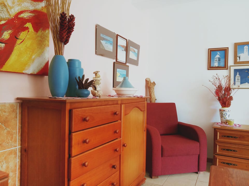 Apartment, 1 Bedroom | Living room | Flat-screen TV
