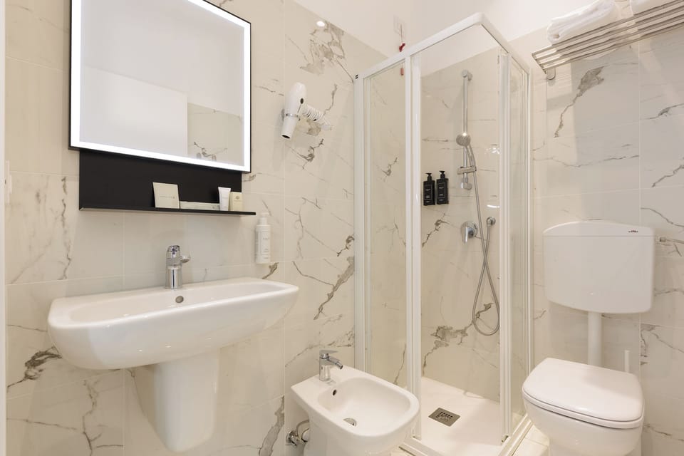 Rainfall showerhead, free toiletries, hair dryer, towels