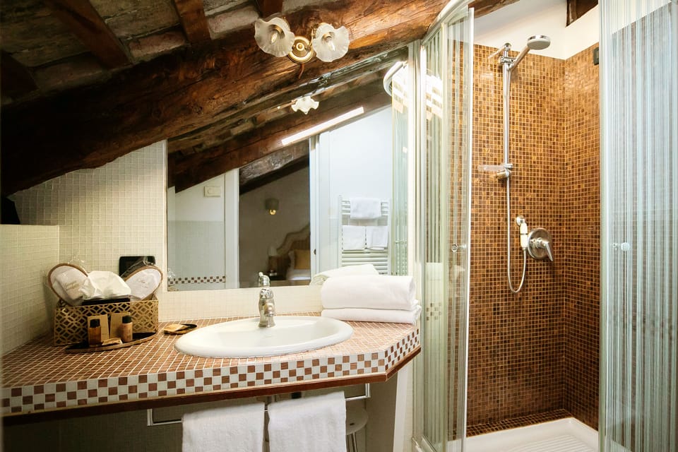 Superior Room | Bathroom | Rainfall showerhead, hair dryer, slippers, bidet