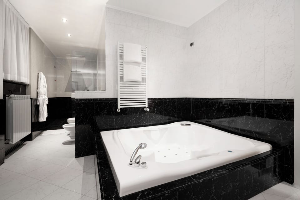 Suite, Hot Tub | Bathroom | Hair dryer, slippers, bidet, towels