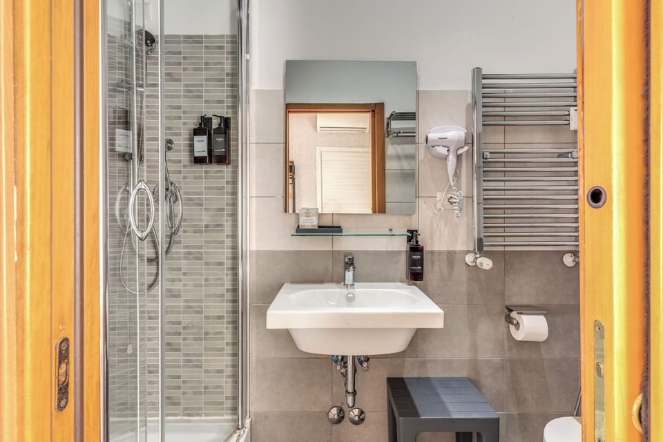 Shower, free toiletries, hair dryer, slippers