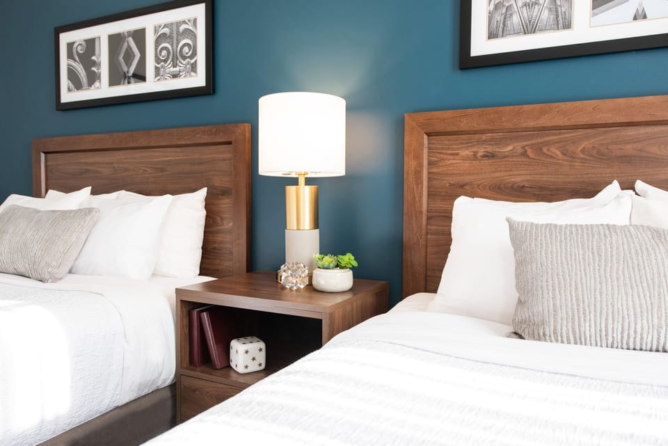 Deluxe Room, 2 Queen Beds | Premium bedding, laptop workspace, blackout drapes, iron/ironing board