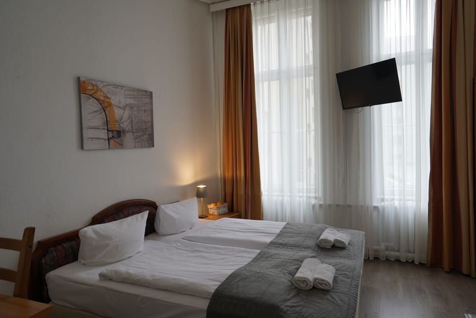 Economy Double Room | Desk, iron/ironing board, cribs/infant beds, free WiFi
