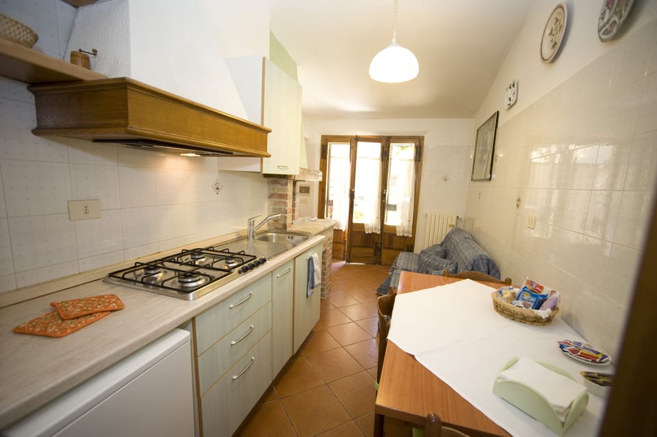 Full-size fridge, microwave, stovetop, coffee/tea maker