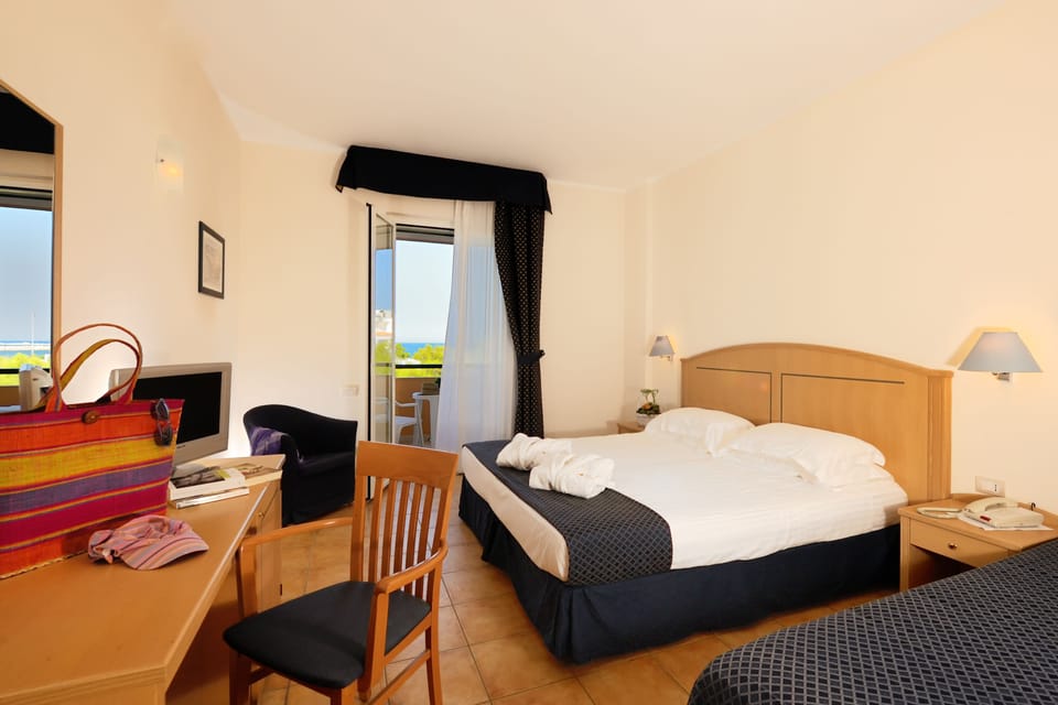 Superior Triple Room | Minibar, in-room safe, desk, soundproofing