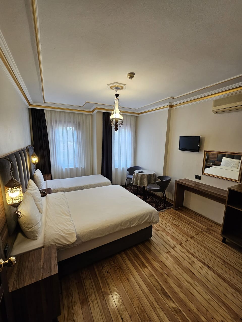 Standard Triple Room, Multiple Beds, Non Smoking, City View | 1 bedroom, minibar, individually decorated, individually furnished