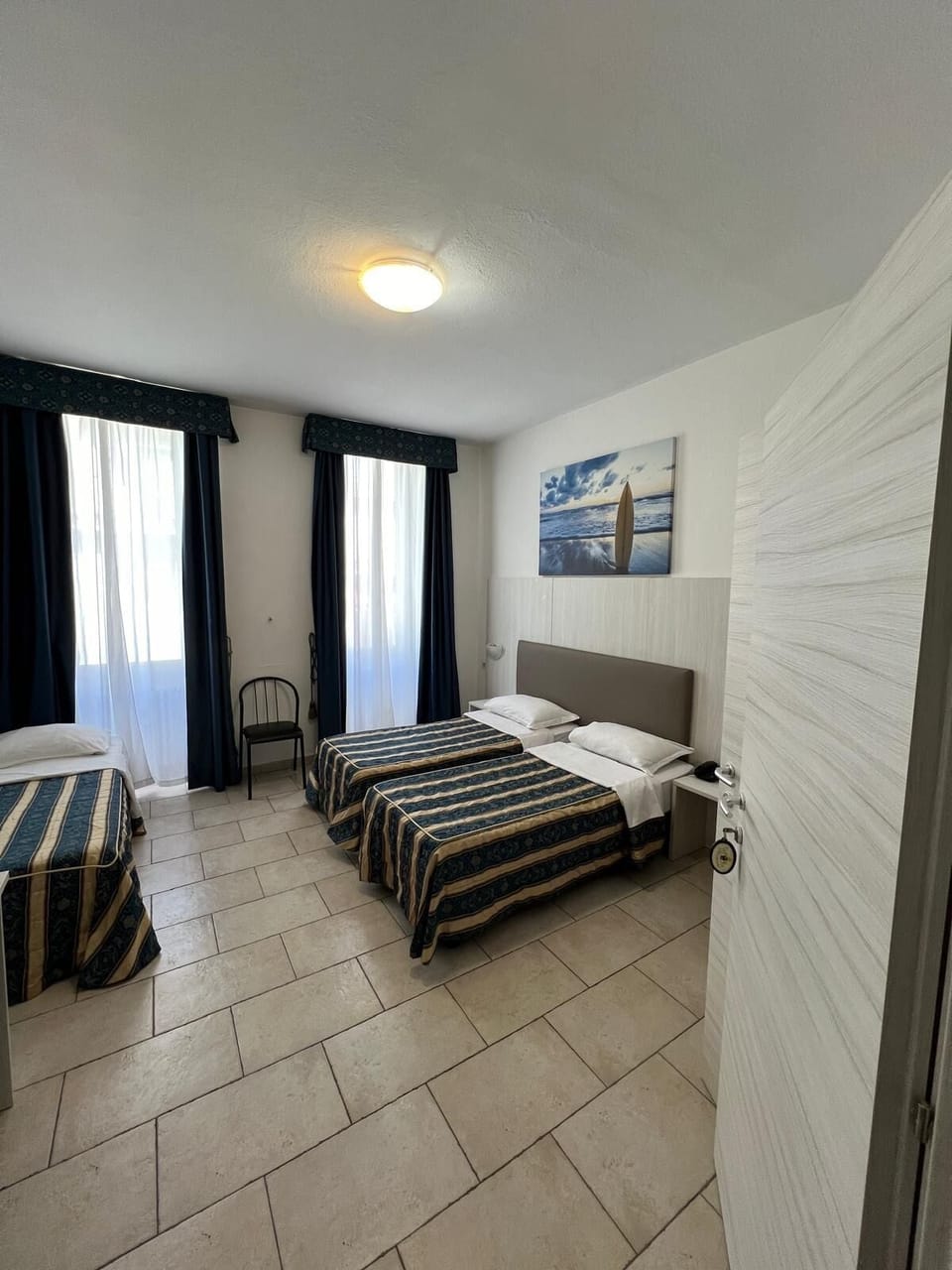 Triple Room | Down comforters, desk, WiFi (free), bed sheets