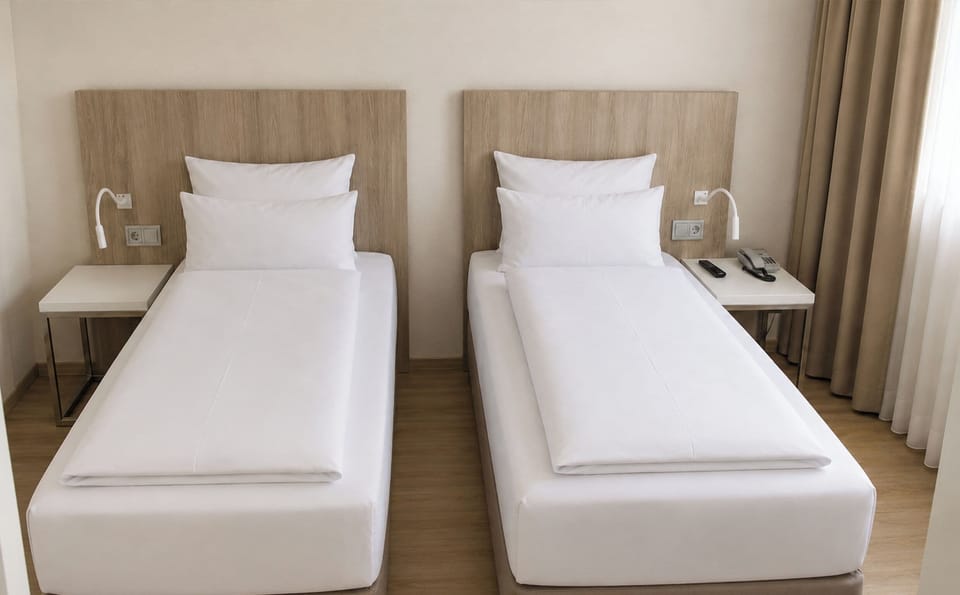 Twin Room | Minibar, in-room safe, desk, free WiFi