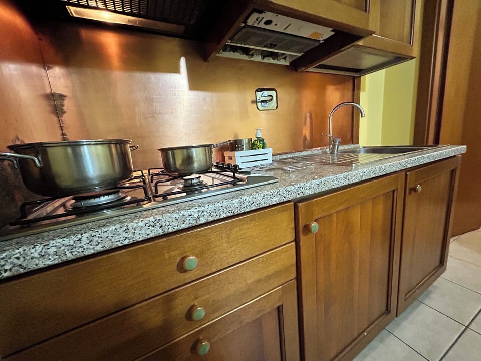Deluxe Apartment (Acquario) | Private kitchen | Fridge, coffee/tea maker, electric kettle, highchair