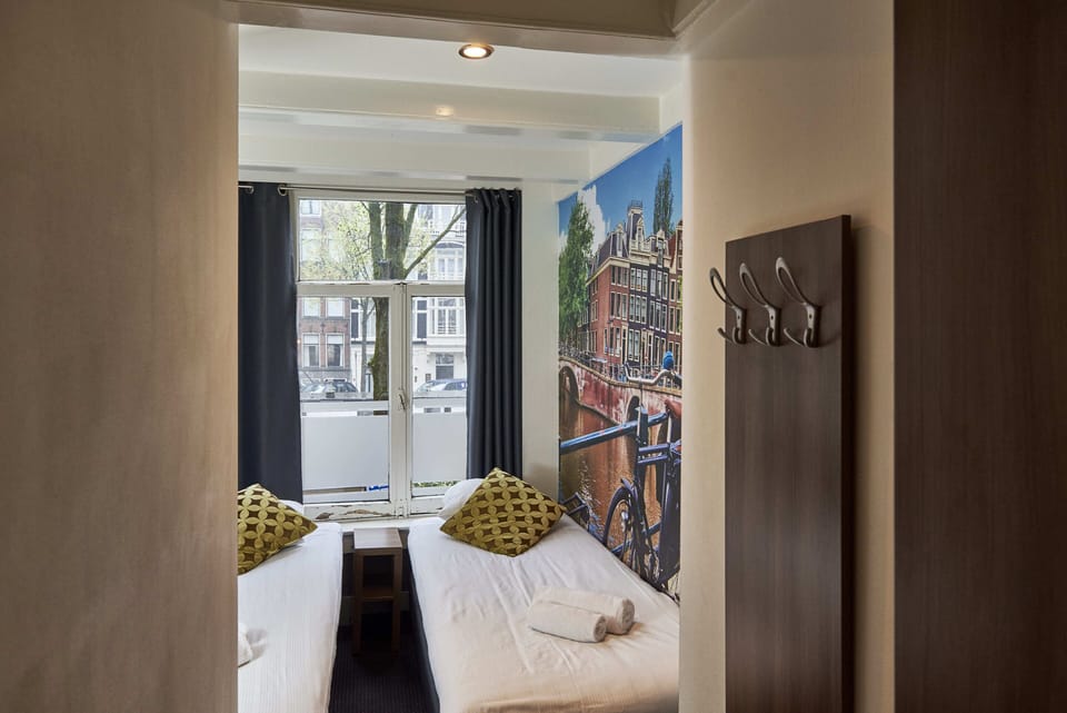 Basic Twin Room, Shared Bathroom | In-room safe, free WiFi, bed sheets