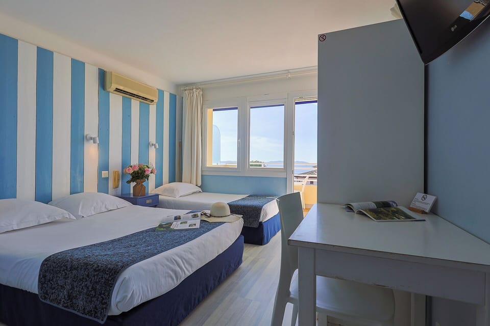 Triple Room, Sea View | Select Comfort beds, in-room safe, free cribs/infant beds, free WiFi