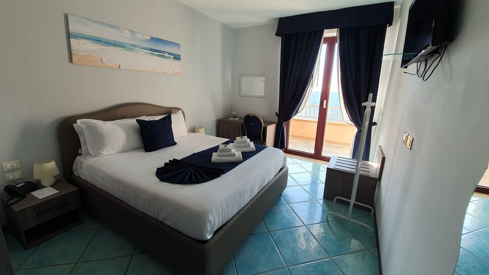 Double Room, Sea View | Down comforters, minibar, in-room safe, individually decorated