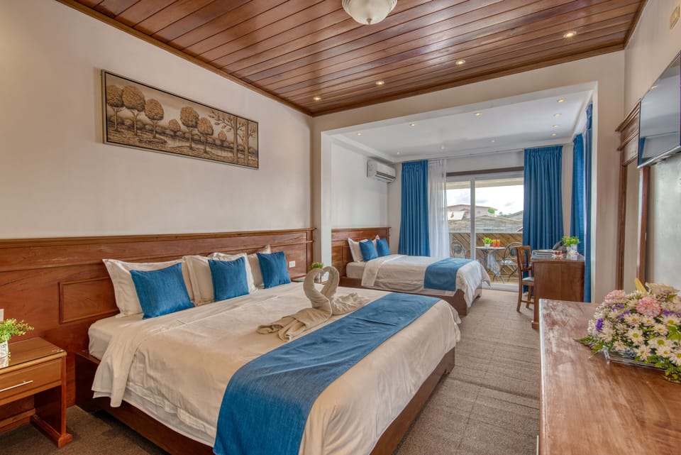 Deluxe Quadruple Room | Premium bedding, minibar, in-room safe, desk